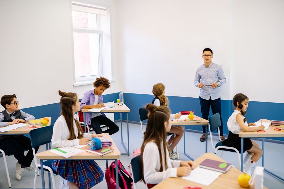 An engaging classroom setting with students collaborating on a project