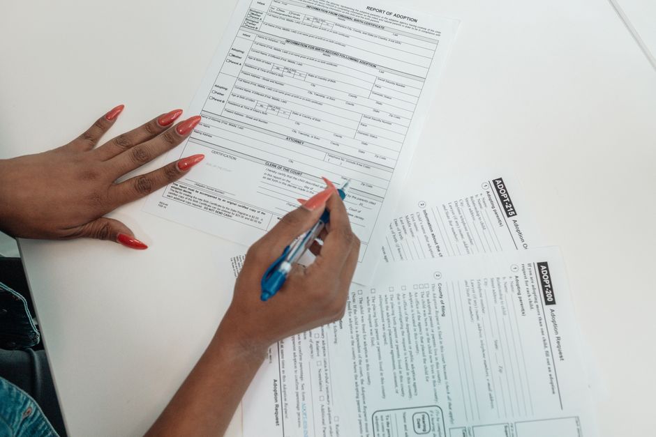 A person filling out an application on the Washington Connection website using a laptop