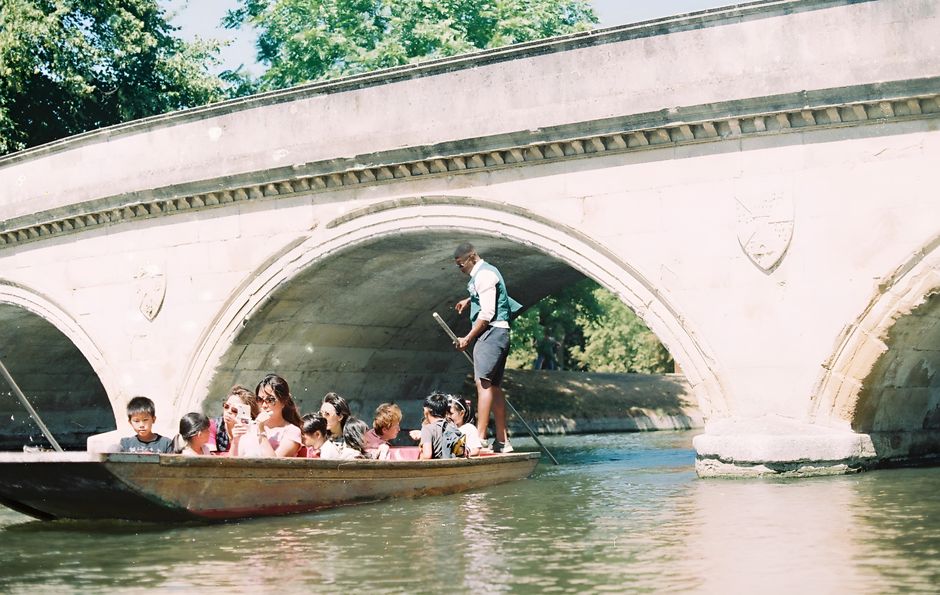 Cambridge students in academic gowns attending a formal matriculation ceremony