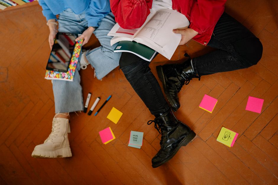 Students in a modern high school language lab wearing headphones and practicing pronunciation